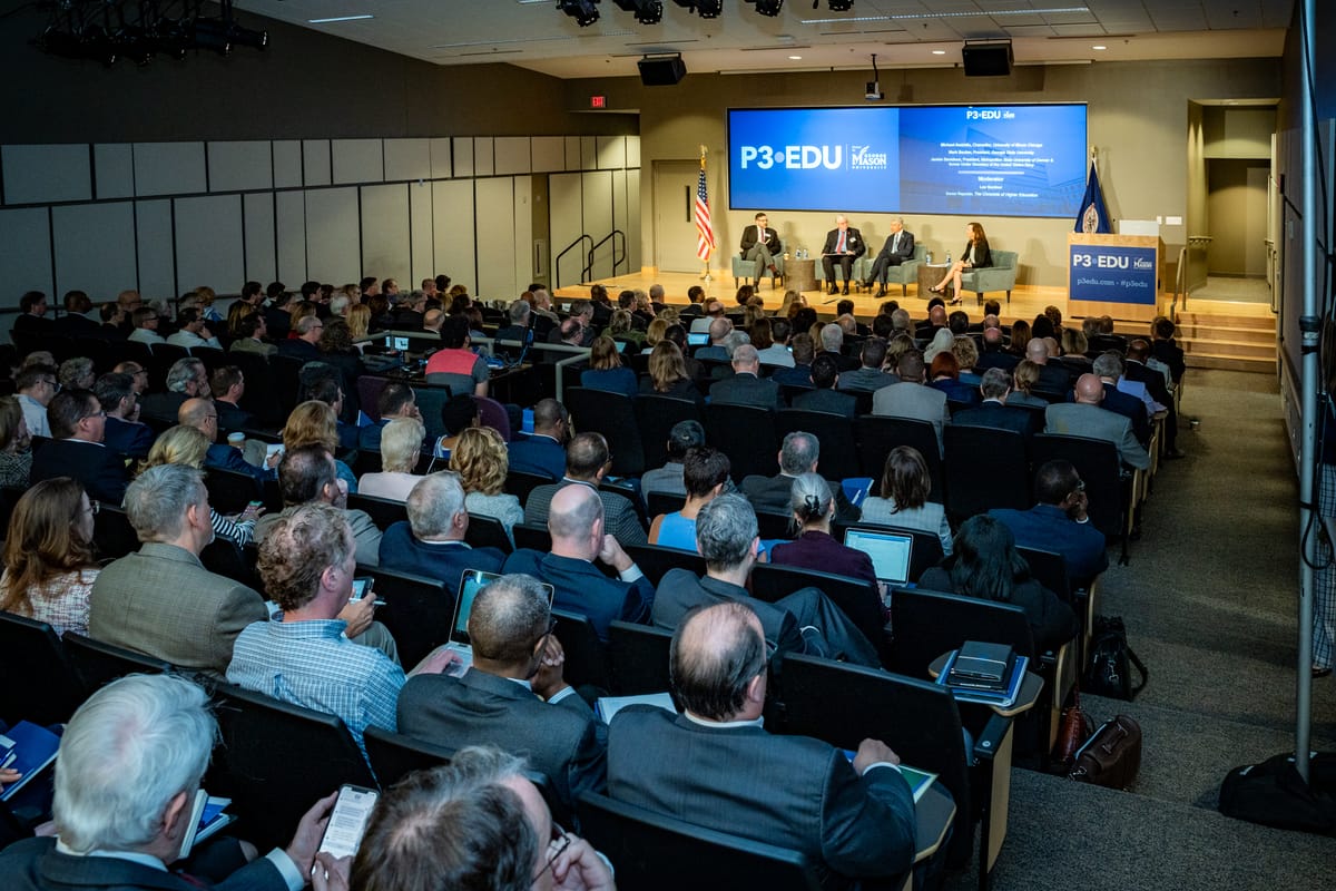 Full auditorium watching a P3EDU panel at George Mason University