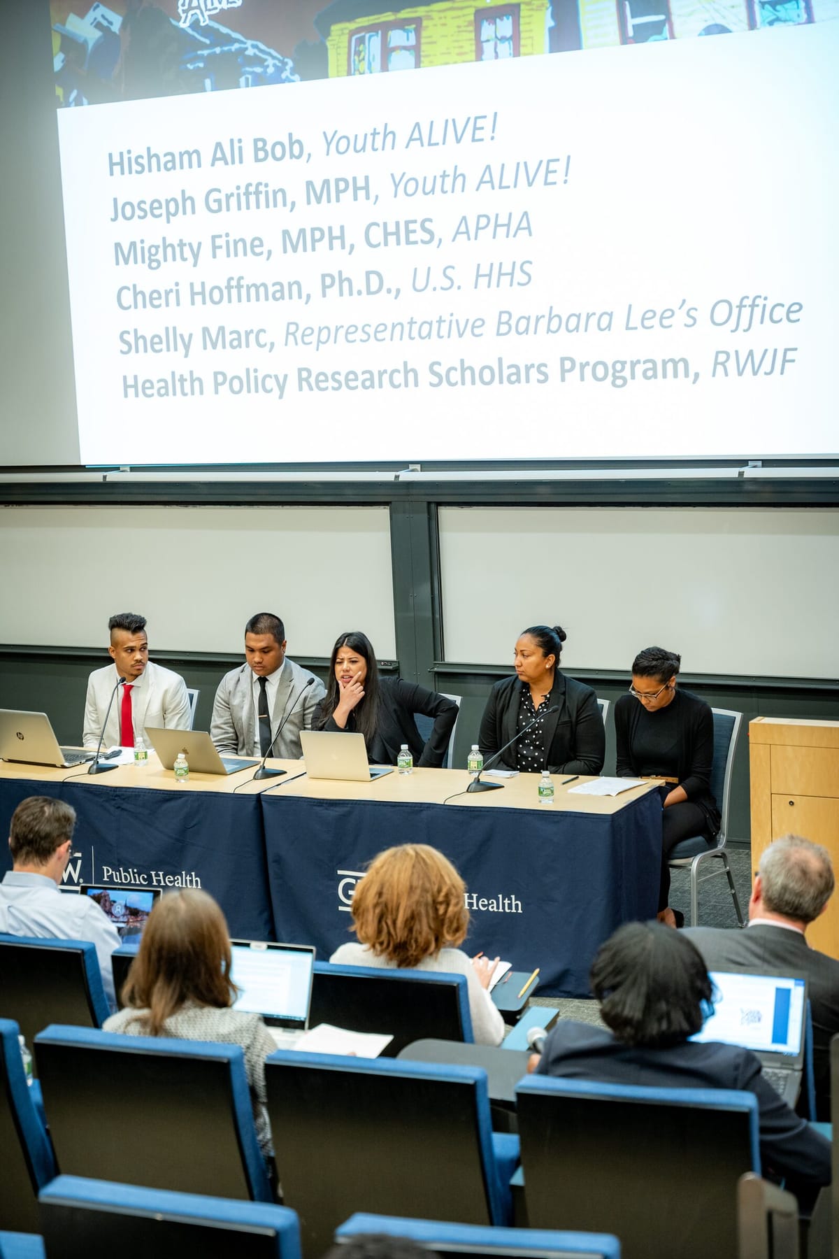 Four panelists speaking at a George Washington University Public Health panel discussion