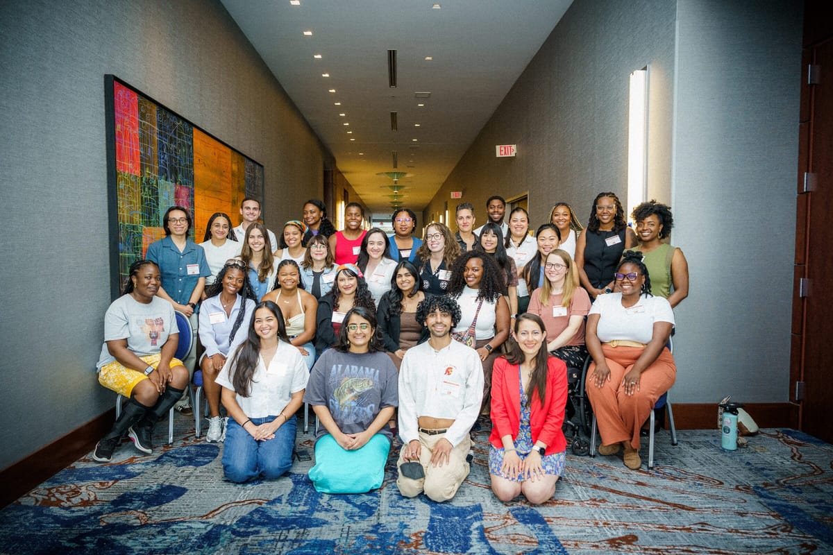 Full cohort group photo of Health Policy Research Scholars in a hotel corridor