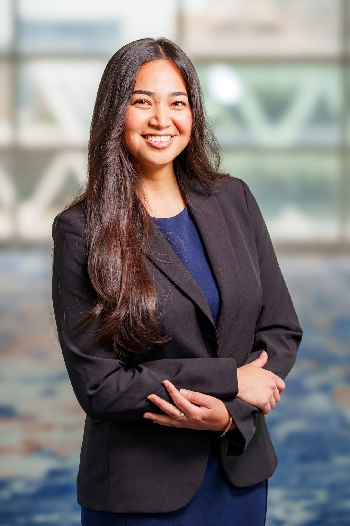 Scholar headshot in a blazer, consistent backdrop and lighting