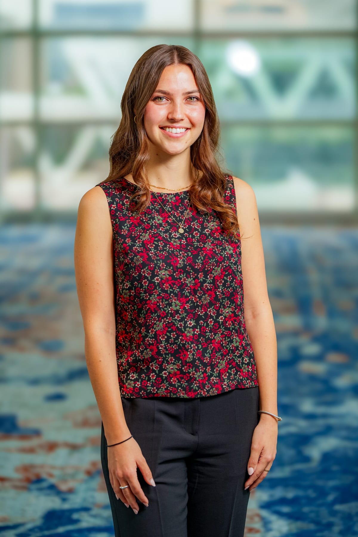 Scholar headshot with the same backdrop and warm lighting